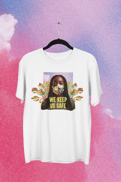 The "We Keep Us Safe Tee" by Disability Culture Lab, part of the Jennifer White-Johnson collection, is displayed on a black hanger against a pink and purple cloudy background. This white T-shirt showcases an illustration of a person with flowers behind them, accompanied by the text "WE KEEP US SAFE." It is union printed for quality assurance.