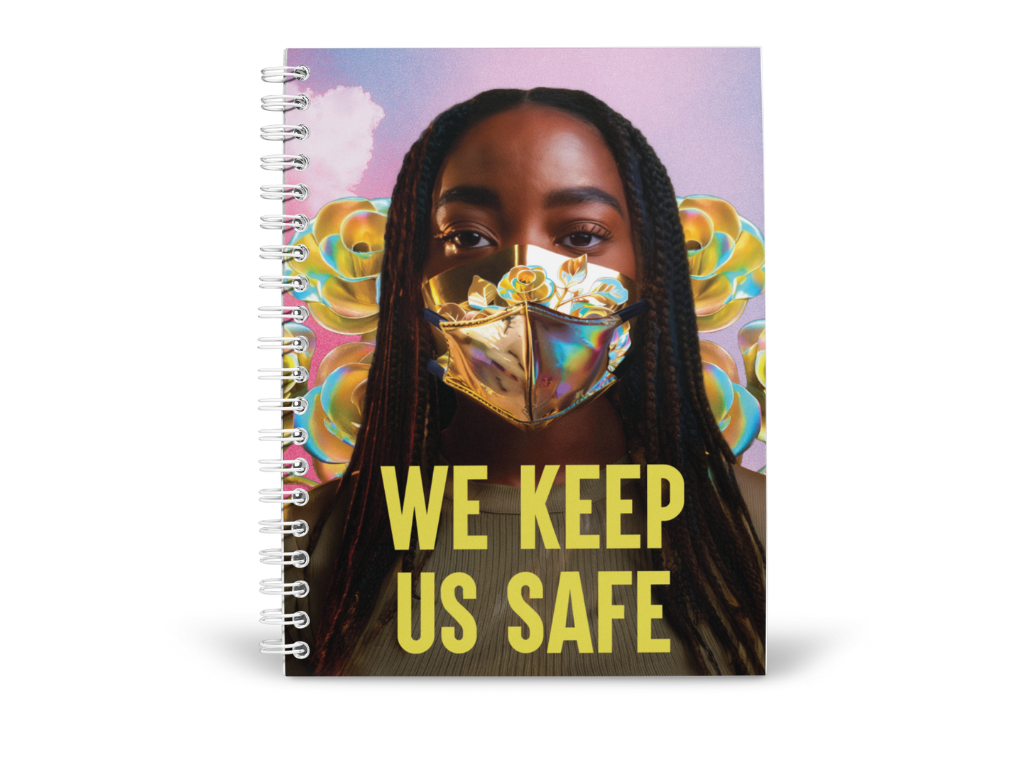 A spiral-bound notebook by Disability Culture Lab features a cover design by Jennifer White-Johnson, depicting a person wearing a colorful face mask adorned with yellow and blue roses. The background highlights abstract pastel shapes, with "WE KEEP US SAFE" prominently union printed at the bottom.